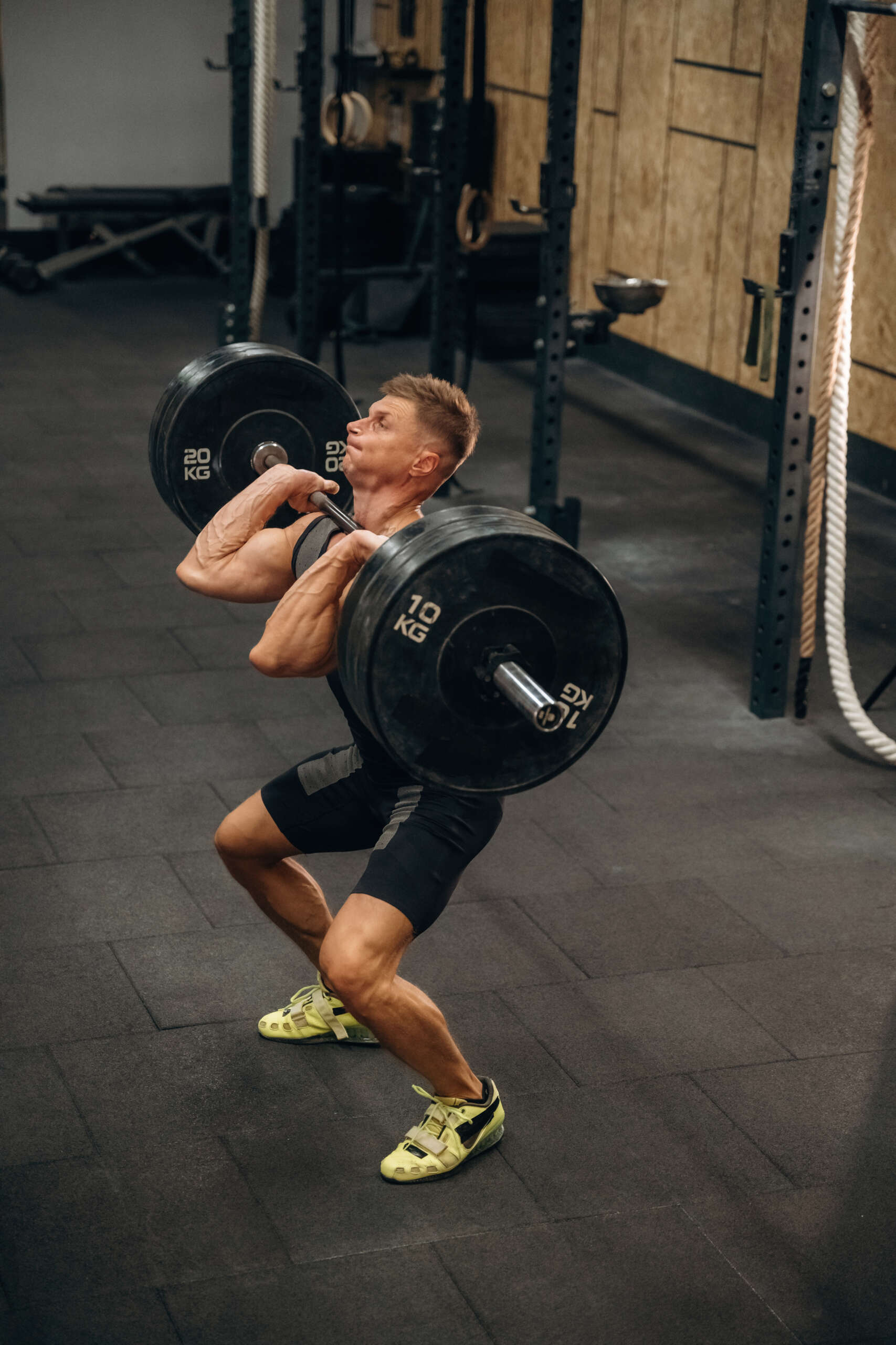 deadlift by athletic man in gym